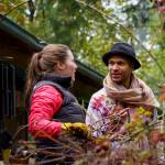 Volunteer Alexa Holmly speaks with homeowner Ian Joseph Jackson.