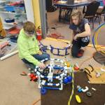 From left, Caleb Arndt, 13 and Elliott Andrews, 15, refine their chassis design.