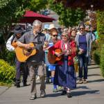 Karl Olsen and Linda Good led an improvised street parade in Langley. (Photo by David Welton)