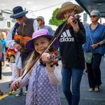 A young student played an instrument. (Photo by David Welton)