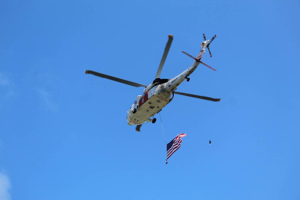 Photo by Karina Andrew/Whidbey News-Times
An NAS Whidbey Island Search and Rescue helicopter executes a flyover at the conclusion of the Service of Remembrance on Memorial Day.
