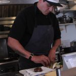 Photo by Karina Andrew/Whidbey News-Times
Ben Jones prepares ingredients for a meal at Oystercatcher.