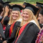 Coupeville graduates Maya and Allie Lucero radiate happiness during the ceremony. (Cynthia Woerner Photography)