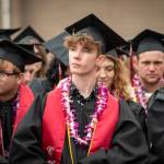 Connor Bachmann, center, and his fellow Coupeville seniors listen to presentations during Saturdays bittersweet high school graduation. (Cynthia Woerner Photography)