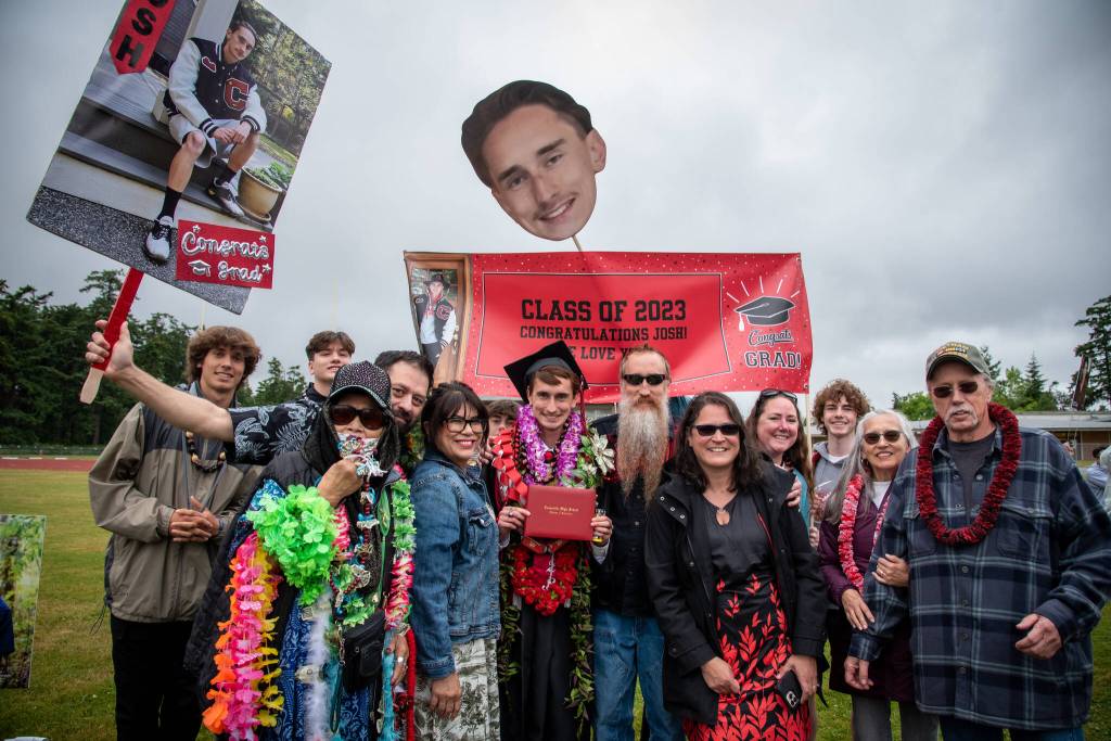 Coupeville High School graduate Joshua Guay and his family celebrate after the commencement ceremony on Saturday. (Cynthia Woerner Photography)