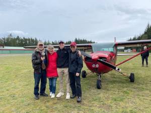 Photos provided
 From left, Fred Lundahl, Nydia Blood, Rowen Stephens and Peter Morton stand in front of a little red plane named Scarlett. The photo was taken after Stephens earned an instructors license.