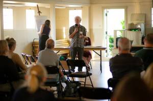 Photos by Ryan Berry / The Herald
John Lovie, director of the Whidbey Island Water Systems Association, speaks at a public meeting June 22 in Coupeville.