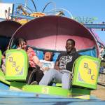 A family has fun spinning at the carnival. (Photo by Luisa Loi / Whidbey News-Times)