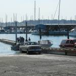 Photo by Luisa Loi
Crabbers prepare to pull their boats out of the water with the help of the new ramp float.