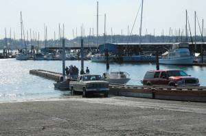 Photo by Luisa Loi
Crabbers prepare to pull their boats out of the water with the help of the new ramp float.