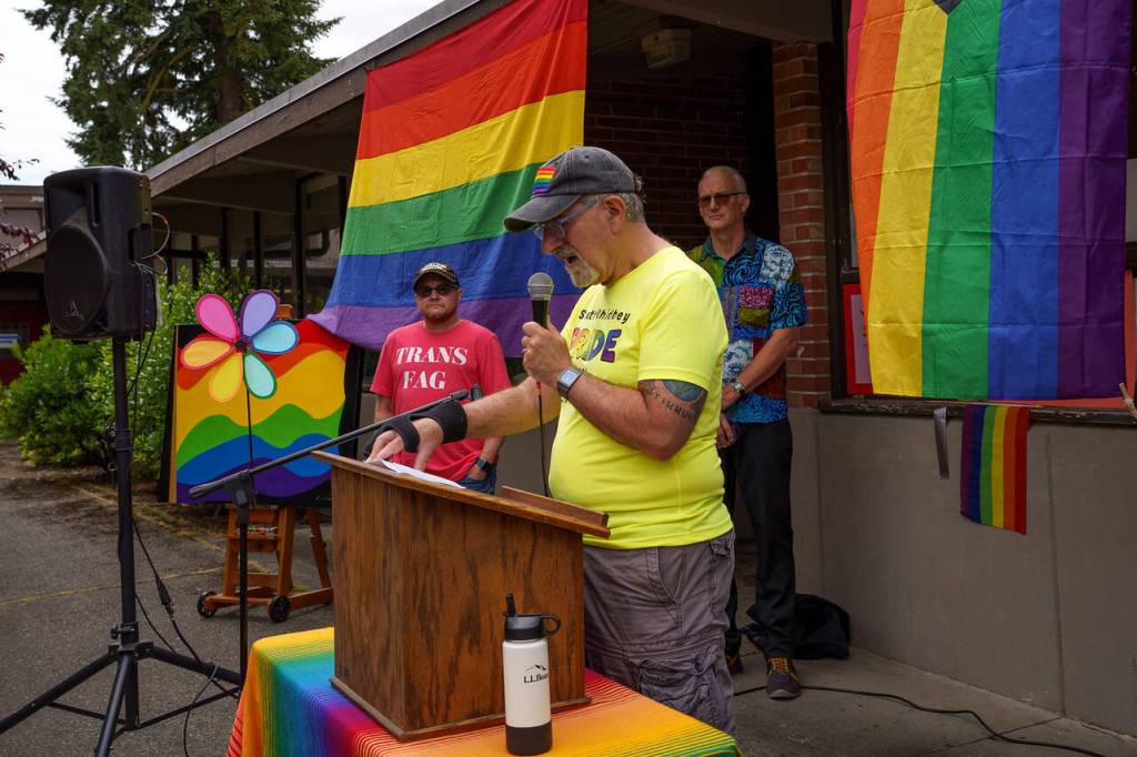 Jeff Natter introduced the speakers at Saturdays Pride event in Langley, which included Wolfgang Nyland, left, and Mayor Scott Chaplin. (Photo by David Welton)