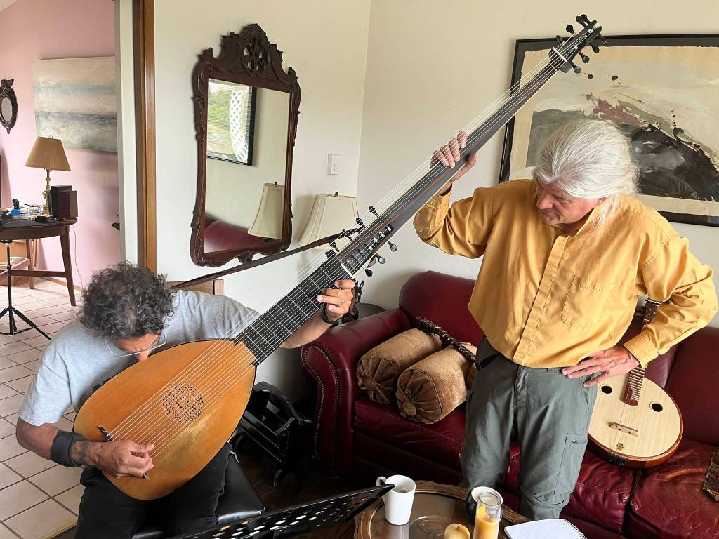 Photo provided
Troy Chapman, left, plays the long-necked theorbo with some support from Gus Denhard. The two guitarists will play with Andre Feriante in a performance at this years Whidbey Island Guitar Festival called Old Men with Lutes.