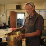 Pelants sifts the seeds into a three-tier strainer.