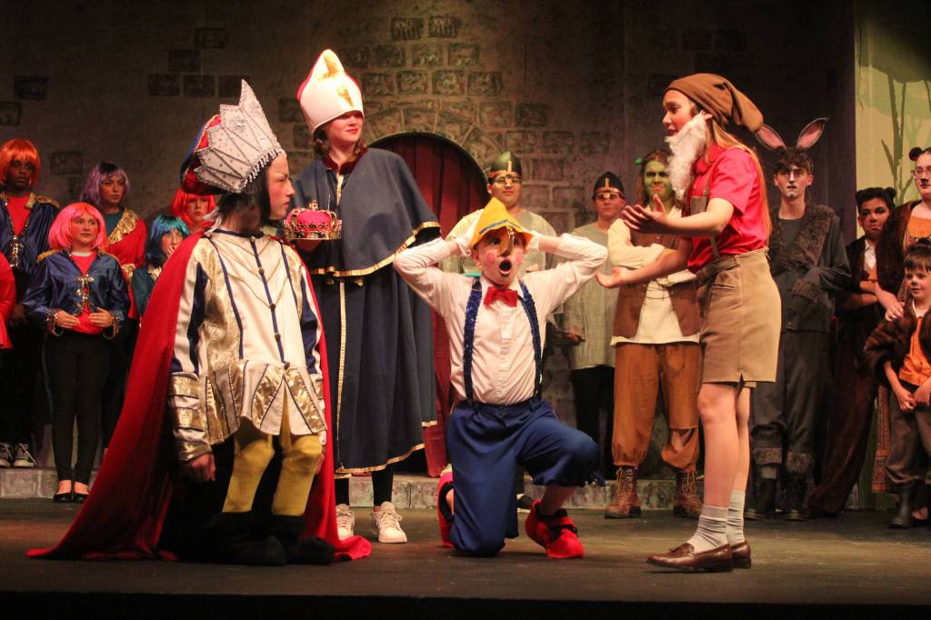 From left, Logan Hendricks as Lord Farquaad, Kinley Quayle as the Bishop, Cillian Burke as Pinocchio and Thorin Allen as the Dwarf perform a scene in which the Dwarf reveals a startling secret about Dulocs wicked ruler.