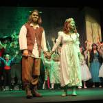 Photo by Karina Andrew/Whidbey News-Times
Reconciled as ogres, Shrek, played by Graham Ray, and Princess Fiona, played by Dana Rivo, lead the cast of fairytale creatures and Duloc residents in the finale.