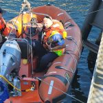 Coxwain Ryan Jones kept a tight hold on the rescued kitten from the emergency vessel that was launched. (Photo provided)