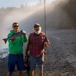 Roland Gobel has success while fishing for salmon at Bush Point with his father Kelly, who is visiting from California. (Photo by David Welton)