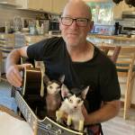 Coupeville resident Eric Arnold with pet Devon Rex cats Lenny and Burble. (Photo provided)