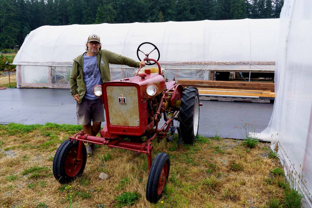 Stephen Williams show off his vintage 1964 Farmall Cub tractor. (Photo by David Welton)