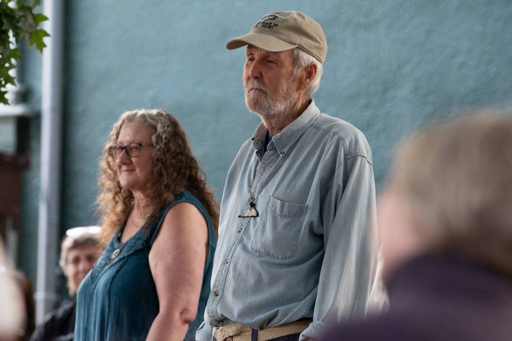 Susan Berta and Howard Garrett, co-founders of the Orca Network, spoke during the vigil held for Tokitae in Langley Saturday night. (Photo provided by Orca Network)