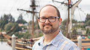 Erich Ebel, author of Exploring Maritime Washington, with the Lady Washington. (Photo provided)
