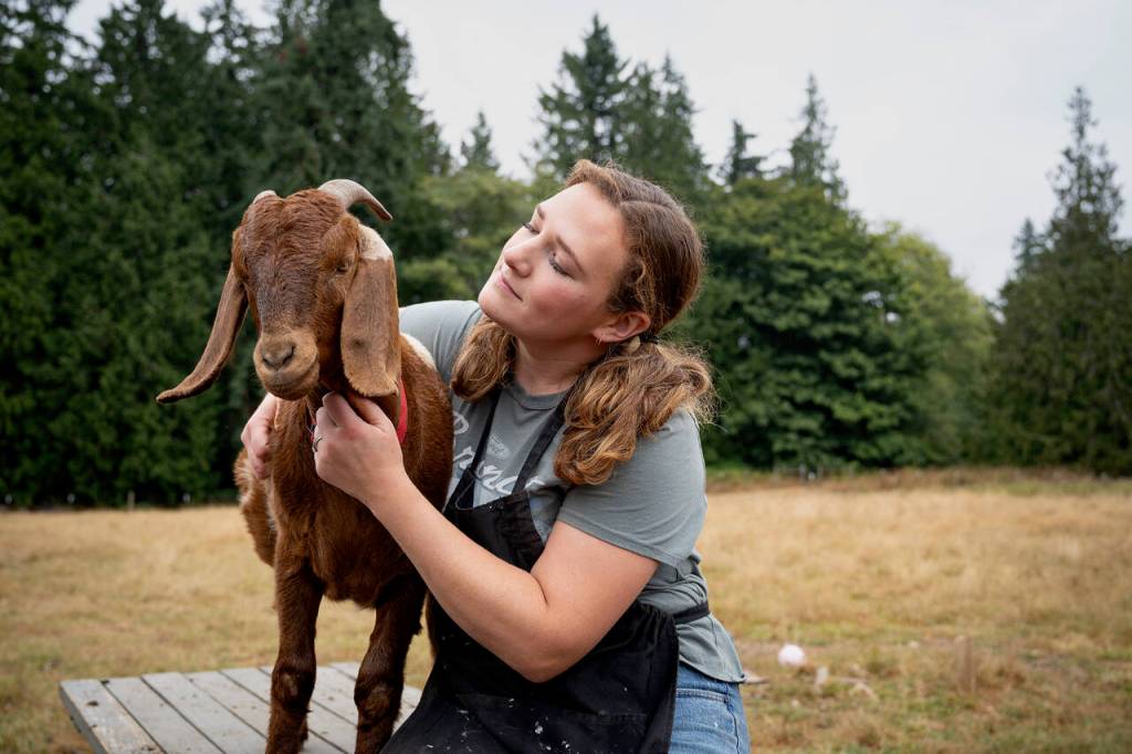 Photo by David Welton
Sarah Santosa with Peter the goat.