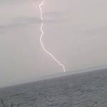 Photo by Robert Coleman
Lightning strikes near Keystone Spit in Coupeville.