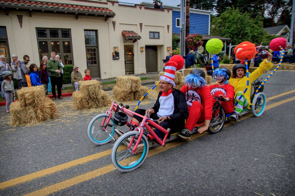 Tim Callison as the Cat in the Hat, Brian Dunnington and Michaleen McGarry as Thing One and Thing Two and Robin Black as Sam I Am in the 2018 Soup Box Derby. (Photo by David Welton)