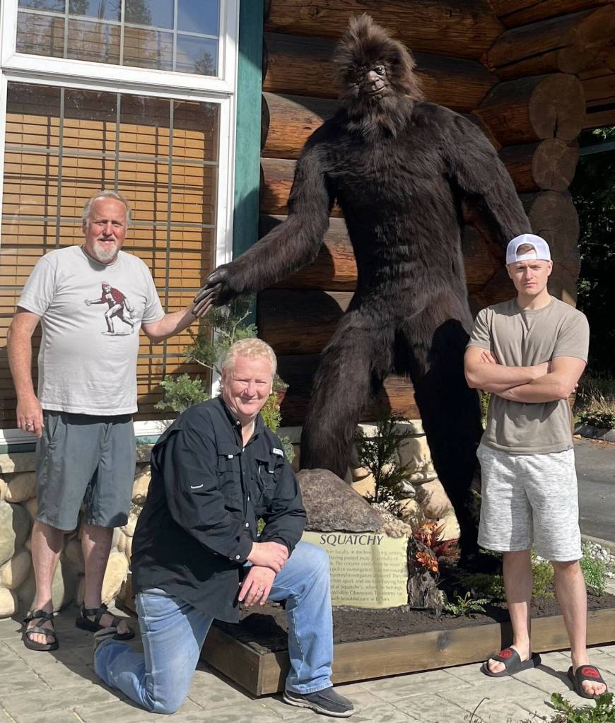 (From left to right) Scott Meaker, Charles Usery and Meakers son Nathan pose with Squatchy. (Photo provided)
