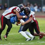 Coupeville players stop a Falcon. (Photo by John Fisken)