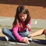 Photo by Karina Andrew/Whidbey News-Times
First grader Maddison Muscutt helps chalk the walk Sept. 15 at Hillcrest Elementary School.