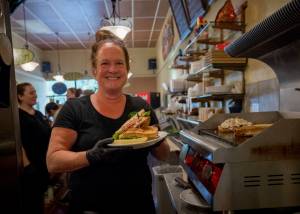 Photo by David Welton
Pickles Deli owner Kim Bailey with a freshly made BLT.
