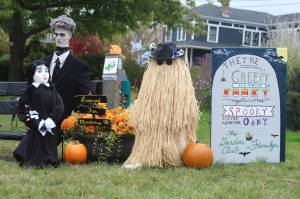 Members of the Addams Family take up residence in Cooks Corner Park for Coupevilles annual scarecrow competition. (Photo by Karina Andrew/Whidbey News-Times)