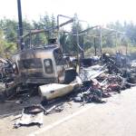 An RV was destroyed in a fire Sunday at a roadside homeless encampment. (Photo by Luisa Loi / Whidbey News-Times)