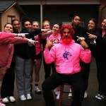 Members of the Oak Harbor High School volleyball team pose with photographer John Fisken after he dyes his hair and beard. (Photo by John Fisken)