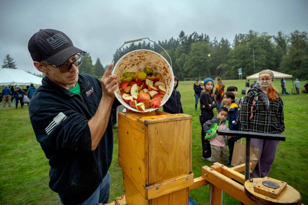 Bobby Lehman pressed gallons and gallons of cider at the Fall Festival this past weekend in Langley. (Photo by David Welton)