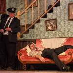 Fugitive Jonathan Brewster (played by Nate Edmiston) sleeps, unaware that Officer Brophy (played by Ron Wilhelm) is standing next to him. (Photo by Luisa Loi)