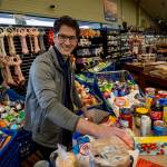 Jadan White, an employee of the Goose Grocer, competed in a bagging competition this week for grocery store courtesy clerks around the state. (Photo by David Welton)