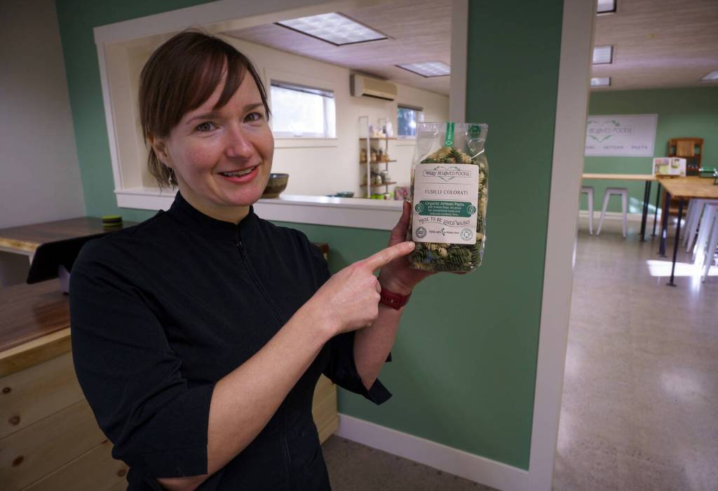 Echo shows a bag of her certified organic fusilli. (Photo by David Welton)
