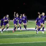 Oak Harbor High Schools girls soccer team celebrates after defeating Arlington in penalty kicks during a play-in game Oct. 26 in the District 1, 3A tournament. The Wildcats continued their winning ways Oct. 28 with a 3-2 victory against Ferndale to advance to the semifinals. (Photo by John Fisken)