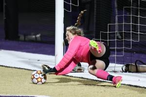 Oak Harbor High School goalkeeper Lauren Marrs blocks a shot
Oct. 26 during a play-in game against Arlington. The game went to penalty kicks
where Oak Harbor won. Photo by John Fisken.