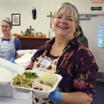 Volunteer Janice Martinovic prepares a meal in 2018. (Photo provided)
