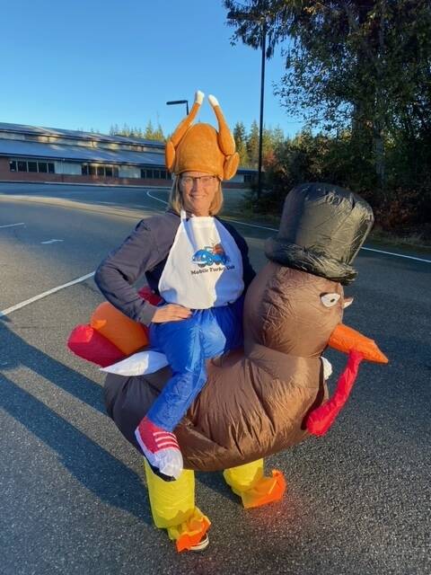 Volunteer Lana Johnson dressed up as a turkey to direct traffic in 2022. (Photo provided)