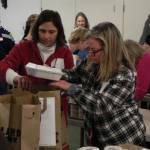 Volunteers Helen Price Johnson, left, and Kim Kramer pack meals in 2014. (Photo provided)