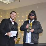Whidbey News-Times Wesley Moran presents a trophy to Jared at Off the Hook, who won Best Bartender. (Photo by Megan Yerton)