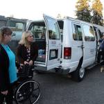 Volunteer Kat Ersch, far left, helps Dana Sawyers, coordinator of the Whidbey Veterans Resource Center, place a wheelchair into the van that makes weekly trips to Seattle to take veterans to medical appointments. (File photo)