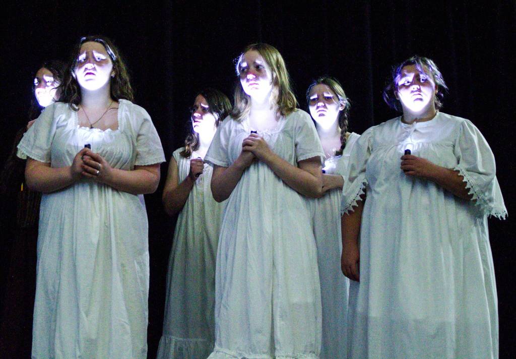 Mental asylum patients wander in the dark in a scene from Nellie. (Photo by Luisa Loi)