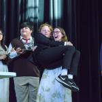 In the foreground, Savannah Dickinson holds Logan Hendricks while rehearsing a scene from No Clue, as Alyza Doctolero, Brian Goodman and Cyrus Amor stand in the background. (Photo by Luisa Loi)