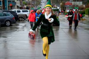 An elf skips down the streets of Langley during a previous years Holly Jolly Parade. (Photo by David Welton)
