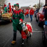 An elf and a goat march in a past Holly Jolly Parade in Langley. (Photo by David Welton)